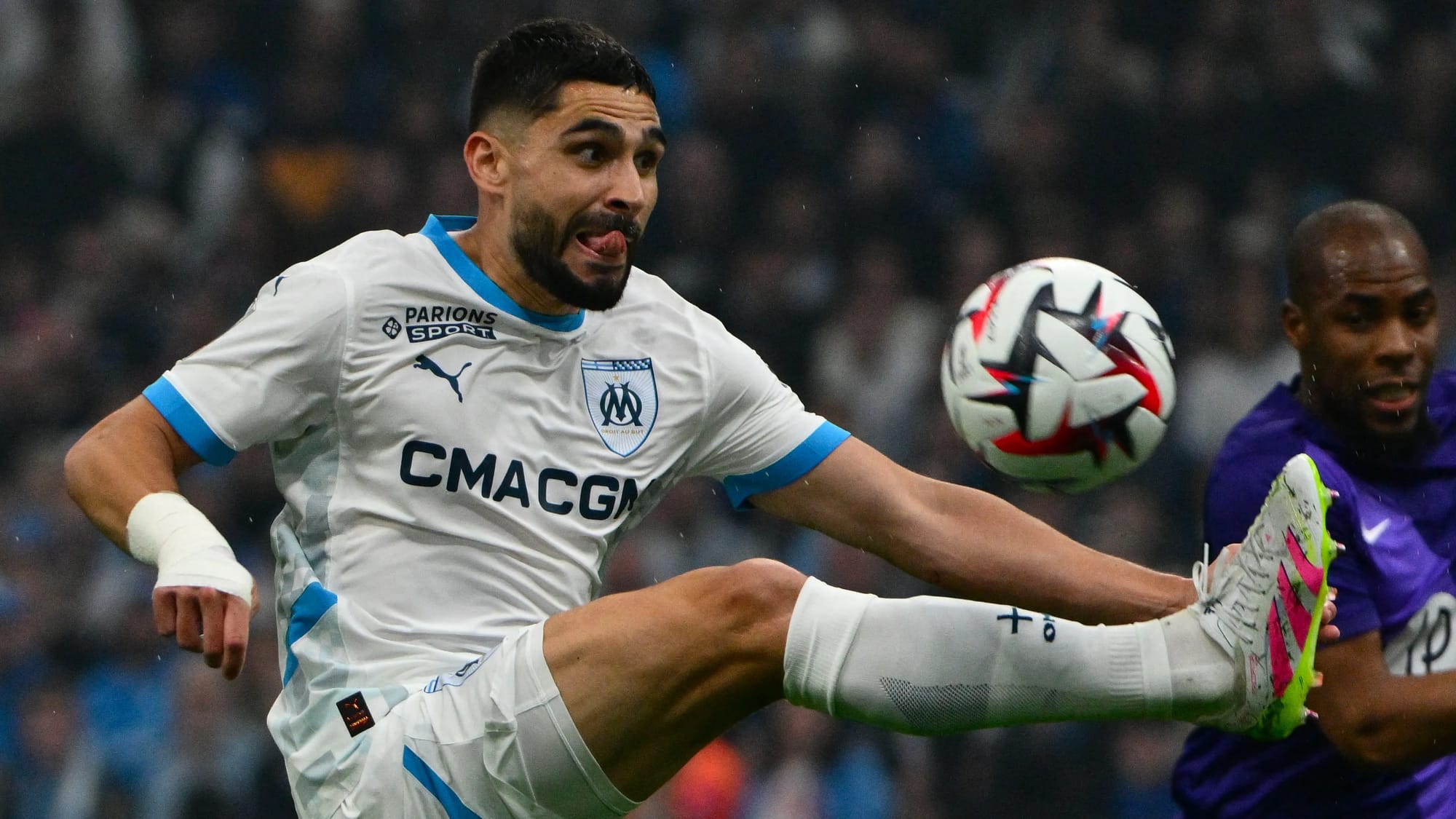 Neal Maupay pictured in headlock with Sevilla staffer over old club tweet — Assets.goal.com
