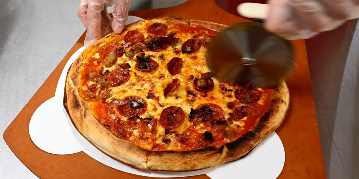 Elon Musk and OpenAI spar over pizza as AI hiring heats up — Businessinsider