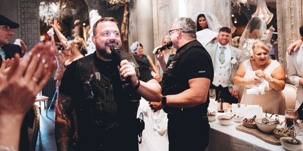 Performers in police uniforms stage surprise 'arrest' at Darlington wedding — People.com